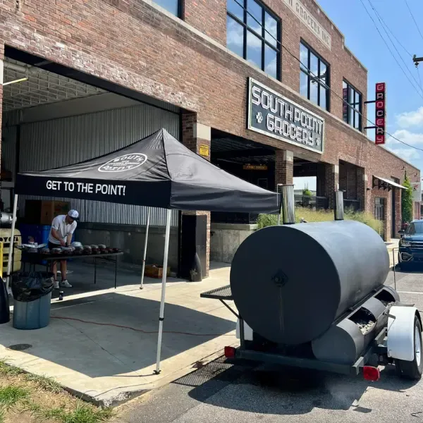 Smoker and BBQ outside of South Point Grocery.